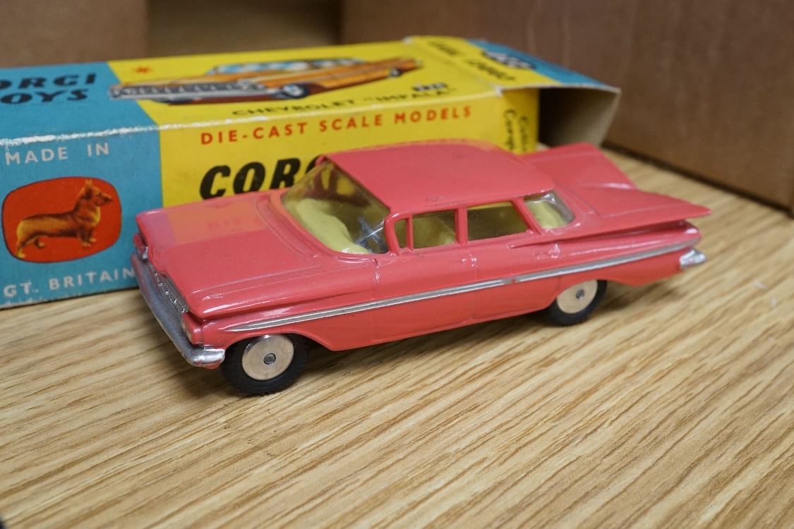 Two boxed Corgi Toys cars; a Bentley Continental Sports Saloon (224) in black and silver livery, with spare wheel, together with a Chevrolet Impala (220) in salmon pink. Condition - good, minor wear and rubbing to boxes.